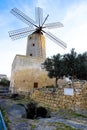 Old traditional windmill in Malta. Now an important tourist attraction. Abandoned structure. Royalty Free Stock Photo