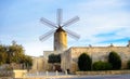 Old traditional windmill in Malta. Now an important tourist attraction. Abandoned structure. Royalty Free Stock Photo