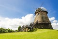 An old traditional windmill with wooden sails. Royalty Free Stock Photo