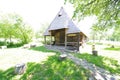 Old traditional wooden barn in the Church of the Archangels Michael and Gabriel yard, Surdesti village, Maramures county, Romania. Royalty Free Stock Photo