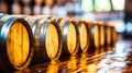 Old traditional wooden barrels with wine, cognac, whiskey, brandy in storage, lined up in a cool and dark cellar