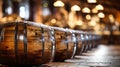 Old traditional wooden barrels with wine, cognac, whiskey, brandy in storage, lined up in a cool and dark cellar