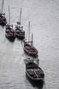 Old traditional wooden boat using for transportation wine barrels in Douro river valley, wine and port making industry in Portugal Royalty Free Stock Photo