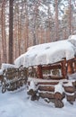 Old traditional wooden country well well made of logs