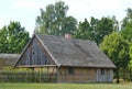 Old traditional wooden family house with straw roof in the Polish countryside Royalty Free Stock Photo