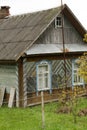 Old traditional wooden house with slate roof in village, Belarus Royalty Free Stock Photo