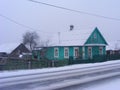 Old traditional wooden russian scenic rustic house in teal color, village of Belarus Royalty Free Stock Photo