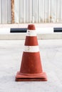 Old traffic cone standing on the road Royalty Free Stock Photo