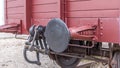Old train carriage on rails, Red wooden train carriage. Old style hook railway coupling