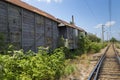 Old cargo train cart abandoned on a disused train line Royalty Free Stock Photo