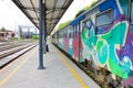 Old train painted by vandals in italian station