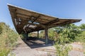 Old train station, abandoned and overgrown - outdoor with destroyed roof Royalty Free Stock Photo