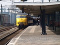 Old train type Mat`64 with commuters on the train station of Gouda Royalty Free Stock Photo