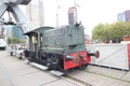 Old train wagon and crane on the quay in the harbor museum of Rotterdam Royalty Free Stock Photo