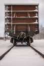 Old train wagon on track in winter