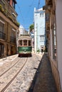 Old tram number 28 on the narrow street of Alfama. Lisbon. Portugal