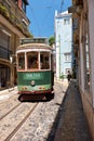 Old tram number 28 on the narrow street of Alfama. Lisbon. Portugal