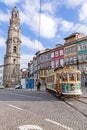 The old tram passes by the Clerigos Tower Royalty Free Stock Photo