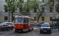 Old tram is running on the street of Podil district in the historical center of Kyiv, Ukraine