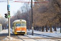 An old tram stands at a traffic light. Royalty Free Stock Photo