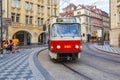 Old trams on main square of Prague`s Mala Strana next to St. Nicholas Church, Prague, Royalty Free Stock Photo