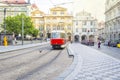 Old trams on main square of Prague`s Mala Strana next to St. Nicholas Church, Prague, Czech Republic Royalty Free Stock Photo