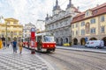 Old trams on main square of Prague`s Mala Strana next to St. Nicholas Church, Prague, Royalty Free Stock Photo