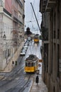 Old trams in a street of the Chiado neighborhood in the city of Lisbon, Portugal;