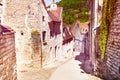 Old tranquil street of Besancon with brick houses