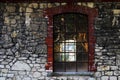 An old translucent window in a vacant building with stone wall Royalty Free Stock Photo