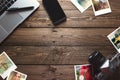 Old travel photos and camera, on office wooden desk table