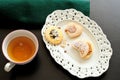 Old tray with pastries for tea and a cup of tea, top view Royalty Free Stock Photo