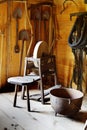 An antique treadle grinding wheel in a vintage reproduction barn. Royalty Free Stock Photo