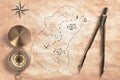 Old treasure island map with navigation instruments top view retro filtered Royalty Free Stock Photo