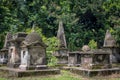 Old trees and ancient gravestones tombs of South Park Street Cemetery in Kolkata, India. The largest Christian cemetery in Asia Royalty Free Stock Photo