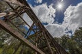 Old trestle bridge on hot summer day in Australia. Royalty Free Stock Photo