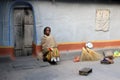 Old tribal Woman Sat in front of her mud house. Environmental Portrait of old tribal lady.