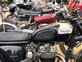 Old triump bonneville parked with other motorbikes