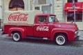 Old truck with Coca Cola brand and advertisement in a street of Prague Royalty Free Stock Photo