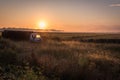 Old truck on a farm field at sunrise Royalty Free Stock Photo