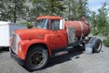 An old truck with fuel at a fishing camp in alaska