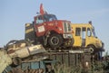 Old trucks and cars sitting on top of a scrap heap in a junk yard in New Jersey Royalty Free Stock Photo