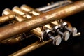 Old trumpet on a dark wooden table. Wind instrument in the old style Royalty Free Stock Photo