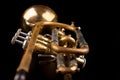 Old trumpet on a dark wooden table. Wind instrument in the old style Royalty Free Stock Photo