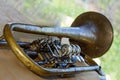 Old trumpet - wind musical instrument. Shallow depth of field. Background is blurred Royalty Free Stock Photo