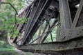 The old truss of the railway bridge. Steel construction connected by rivets. Royalty Free Stock Photo