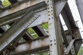 The old truss of the railway bridge. Steel construction connected by rivets. Royalty Free Stock Photo