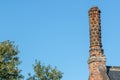 Old tudor rose chimney stack pot. Historic architectural detail.