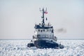 Old tug boat in frozen Lake Michigan