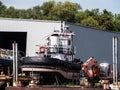 Old tug boat taken out of the water for dismemberment -1